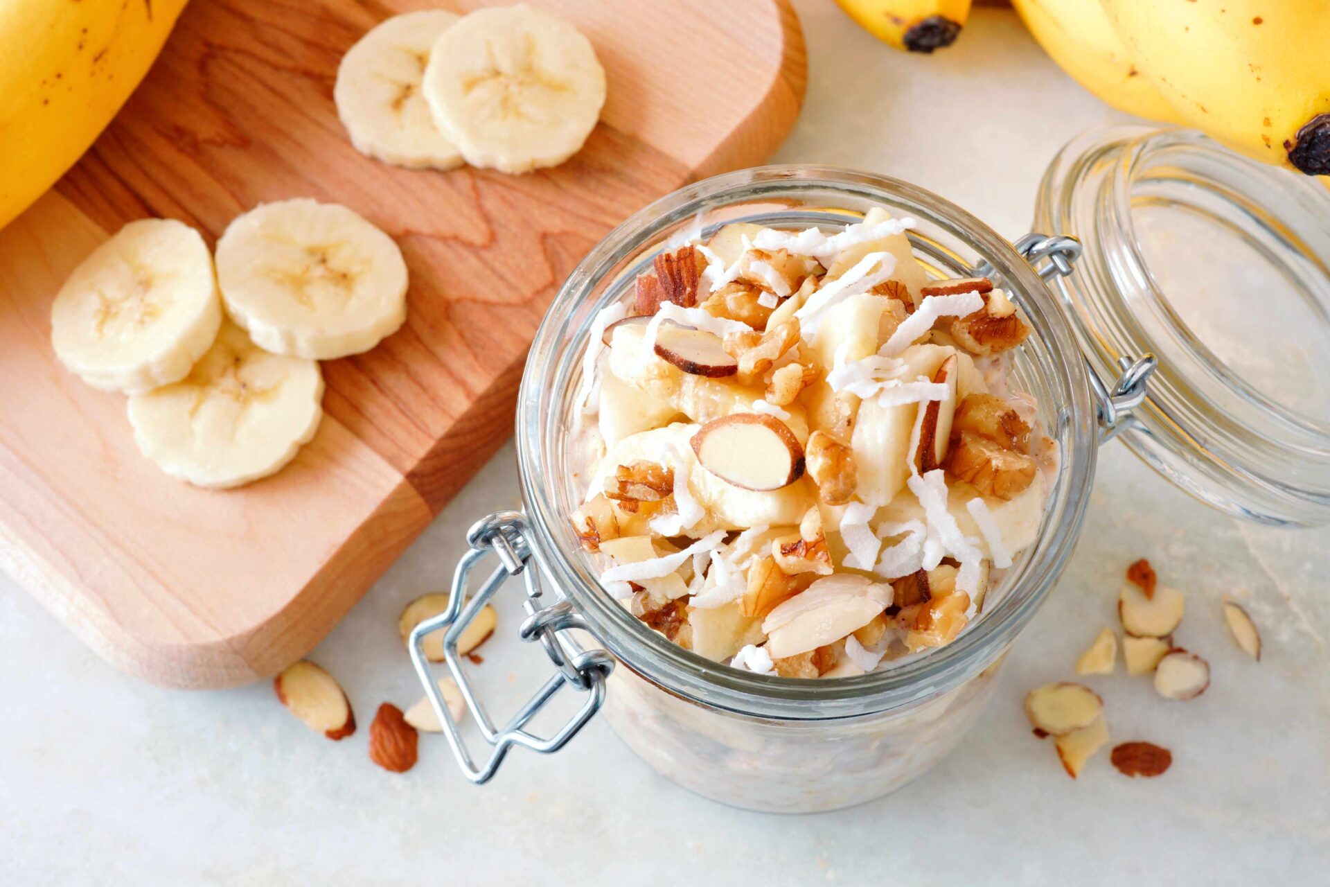 Jar of overnight oats with sliced almonds on top