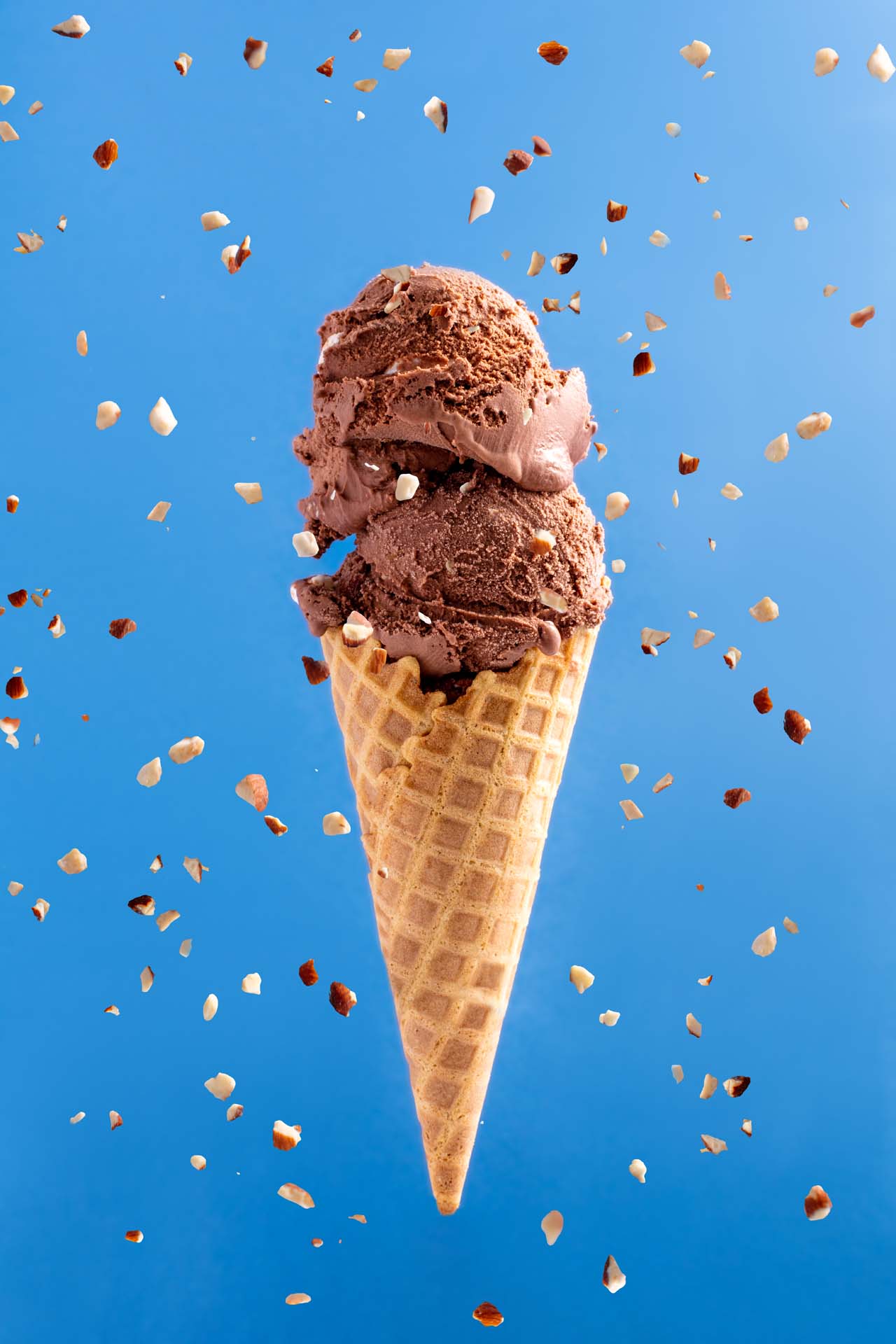 A Ice Cream Cone with Chocolate Ice Cream and Diced Almonds - Ice Cream Favorites