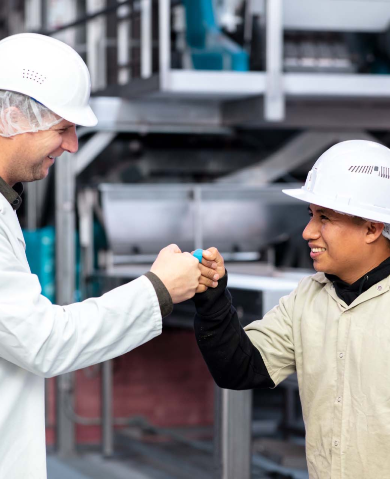 Treehouse Almonds Team Members fist bumping each other - Treehouse California Almond Production