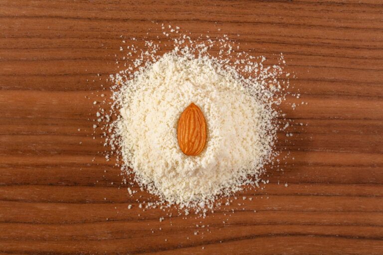 Whole Almond in a Pile of Blanched Almond Flour