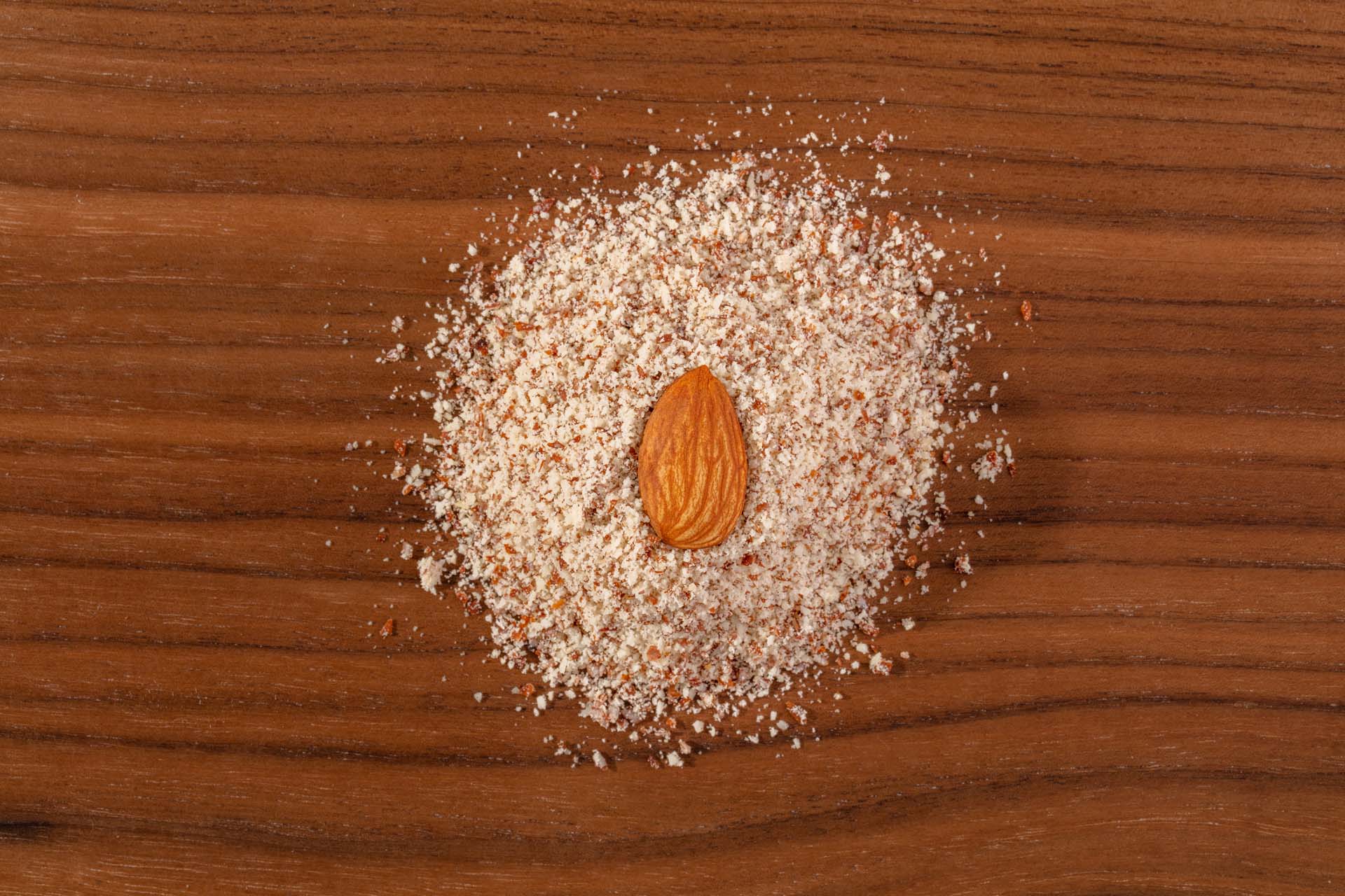 whole Almond in a Pile of Natural Almond Flour