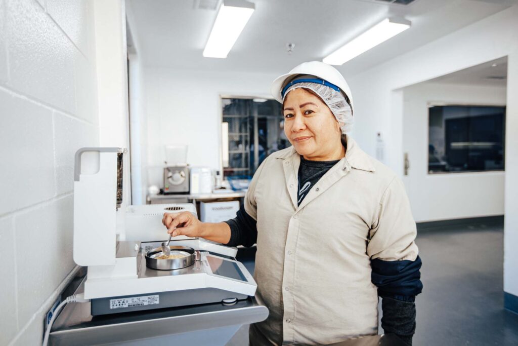 Treehouse Almonds Team Member Checking Moisture Levels of Almond Flour - Highest existing quality standards and certifications